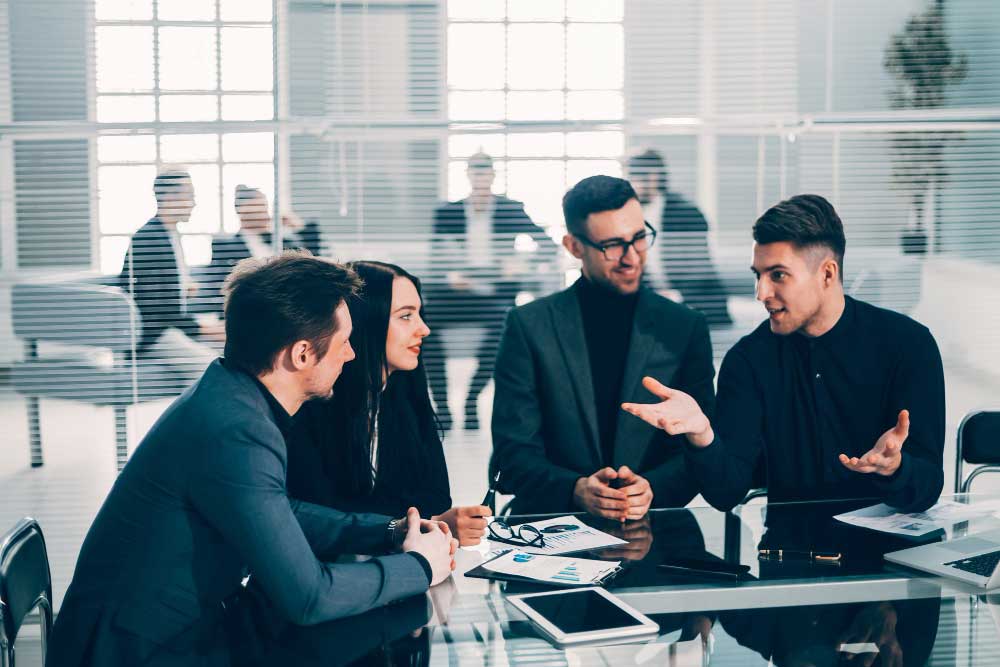 Business professionals discussing strategy for m&a consulting services in Houston